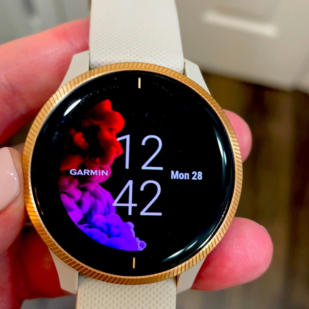 Garmin Women’s Venu Rose Gold with Tan Band.